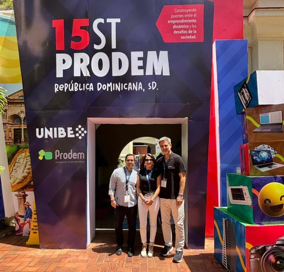 Julian Martínez with other participants in front of the 15ST PRODEM backdrop in Santo Domingo, Dominican Republic